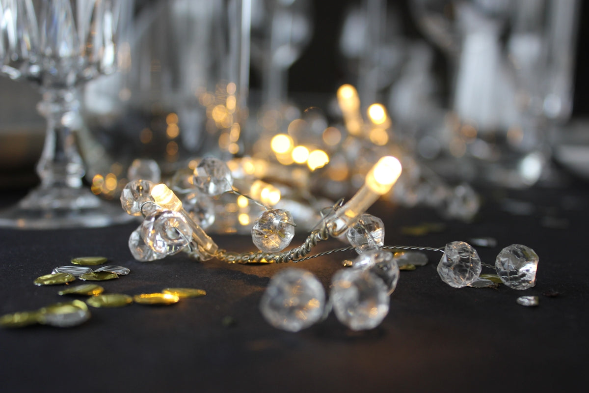 turned-on string light on table