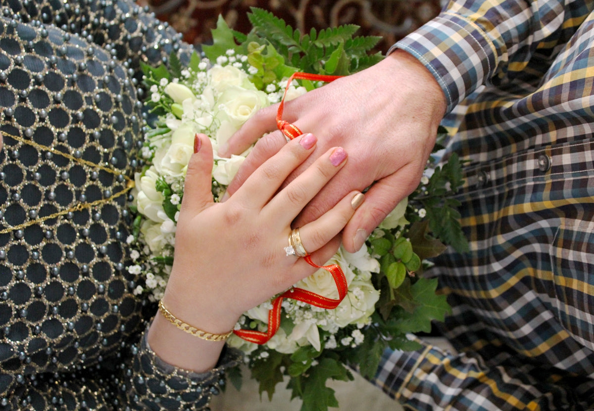 top-view photography of man and woman hands