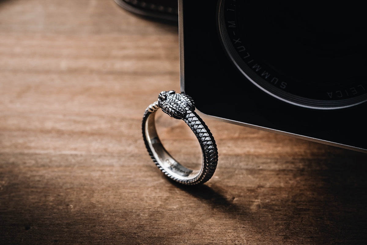 a diamond ring sitting on top of a wooden table