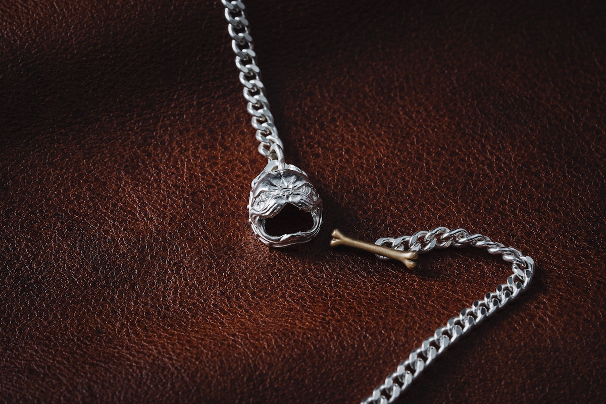 a silver chain with a skull on it