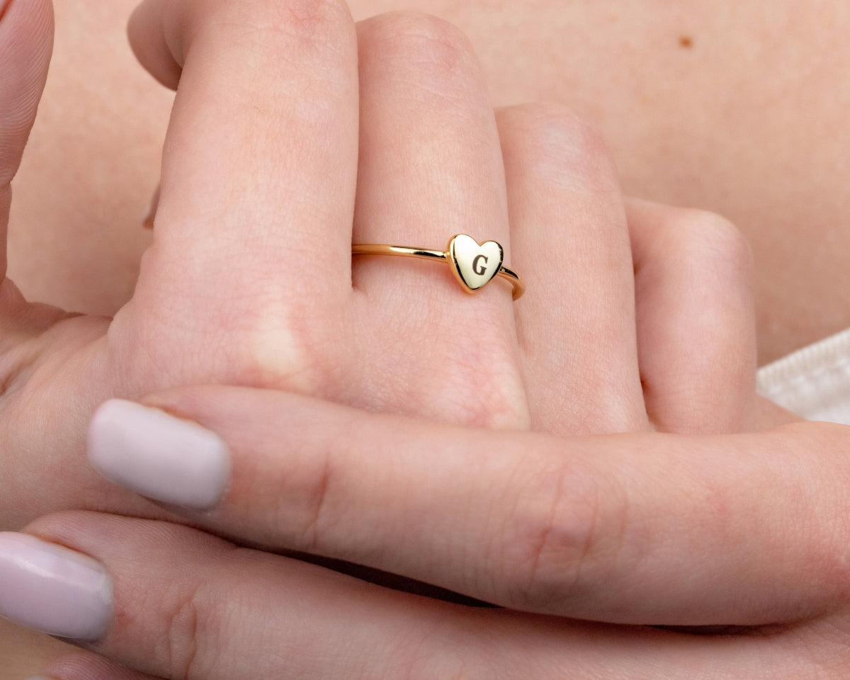 A close up of a person holding a ring