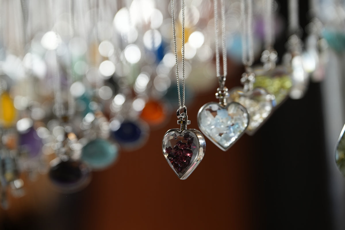 A bunch of beads hanging from a ceiling