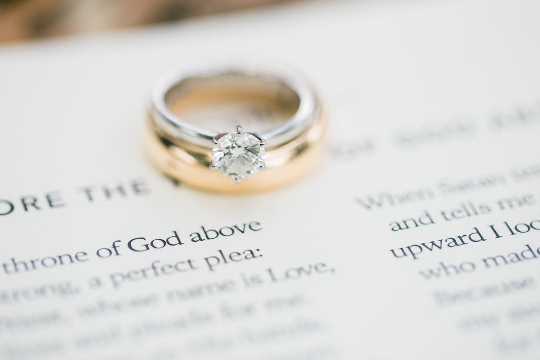 gold ring on white printer paper