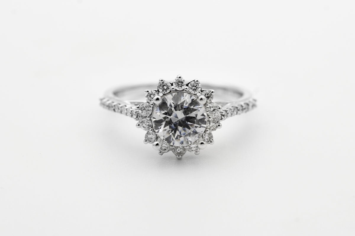 silver diamond studded ring with blue gemstone