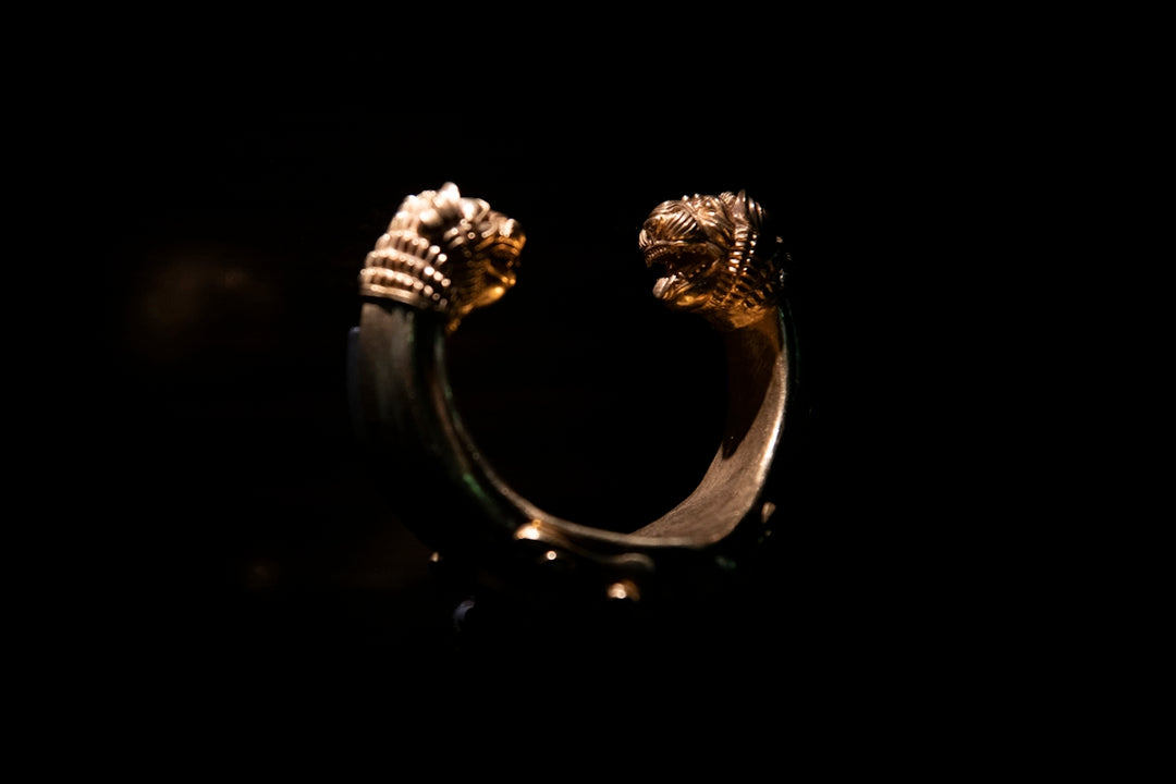 gold ring with black background