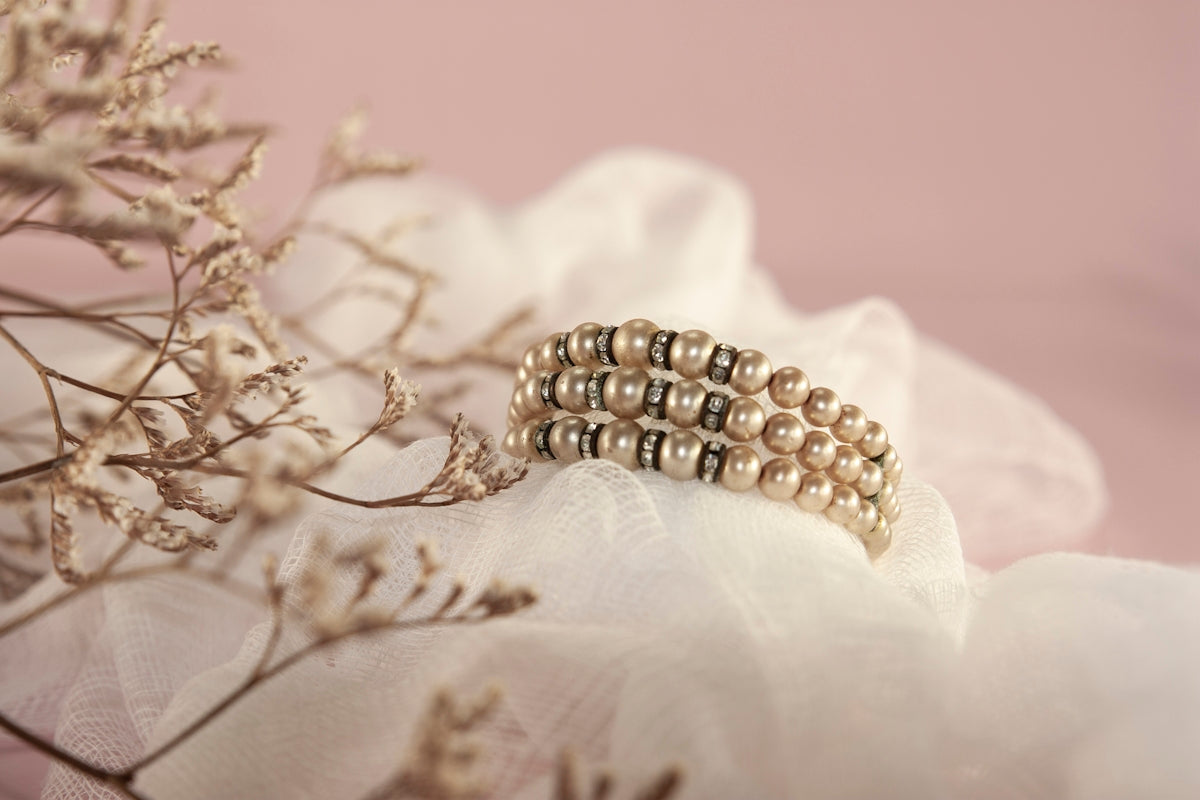 gold and white pearl accessory