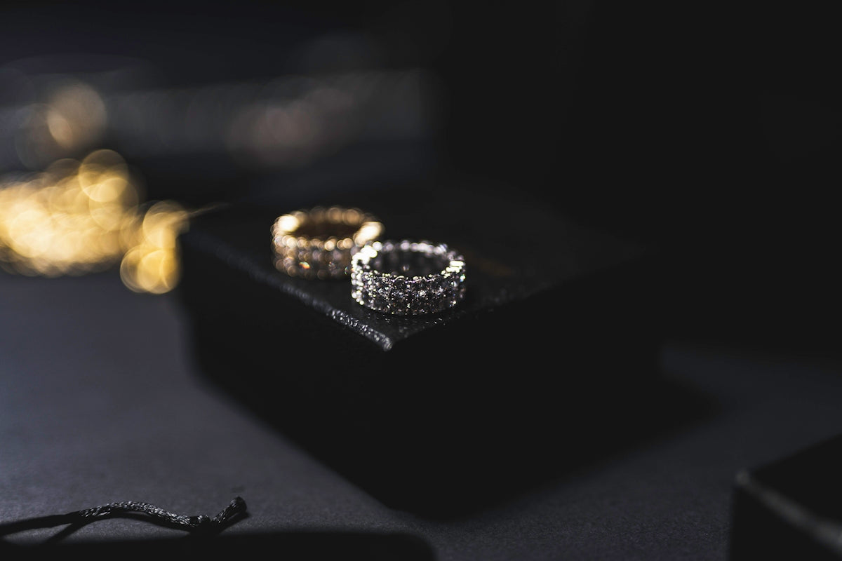 a couple of wedding rings sitting on top of a table