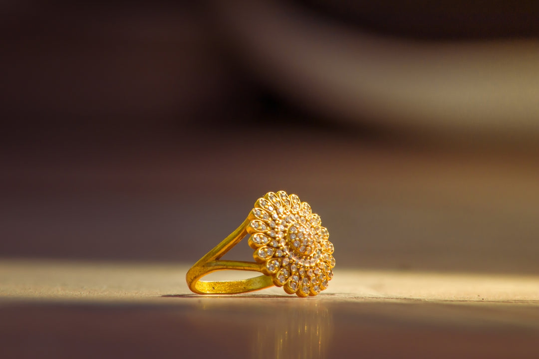 a gold ring sitting on top of a table
