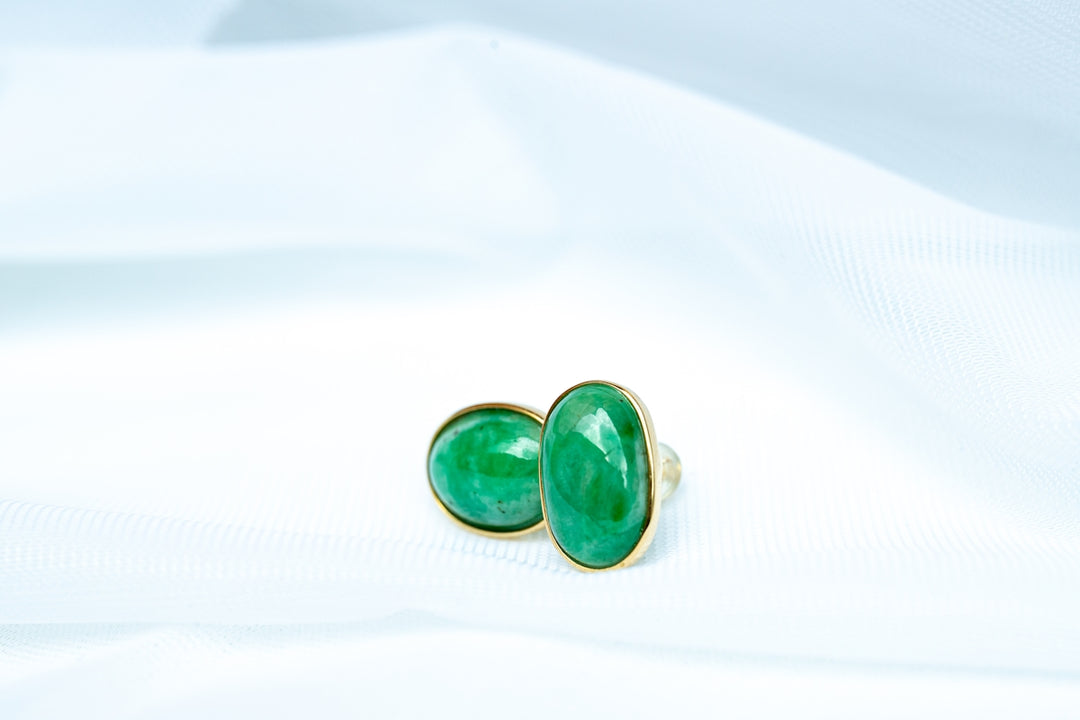 a pair of green and black dice