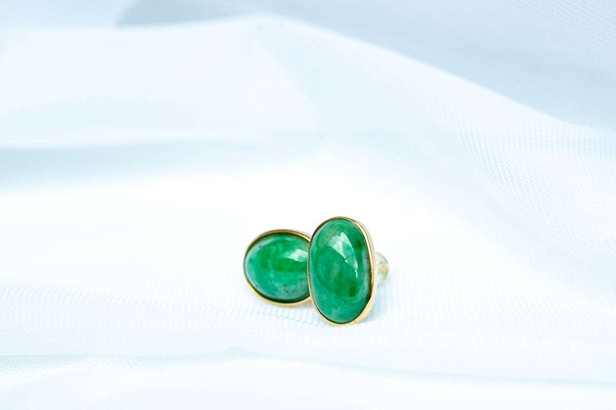 a pair of green and black dice