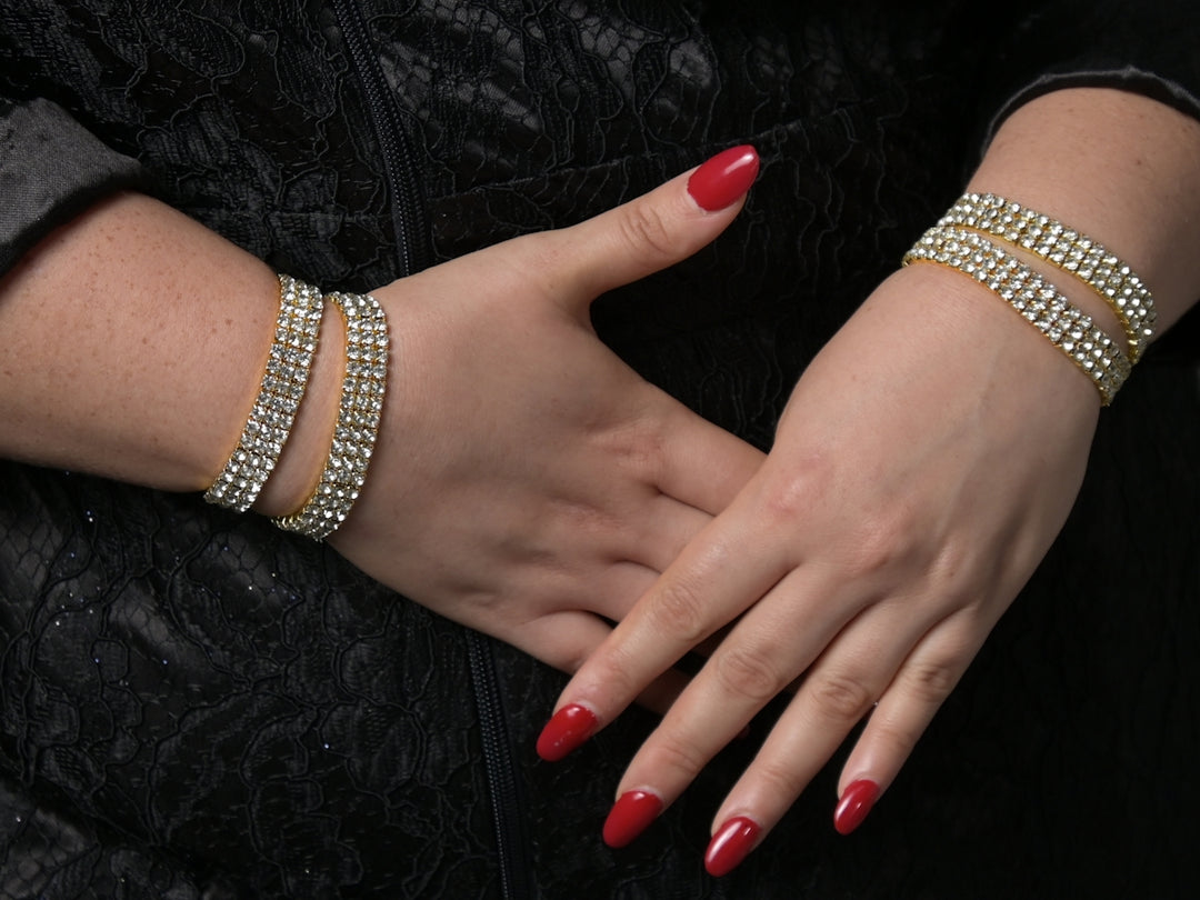 a pair of hands with red nails