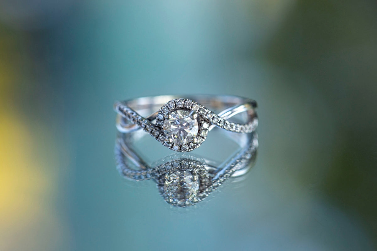 a diamond ring on a blue background