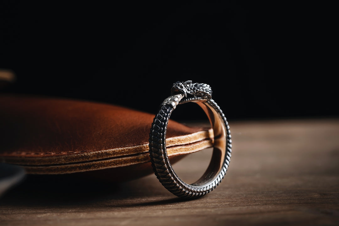 a wedding ring sitting on top of a book