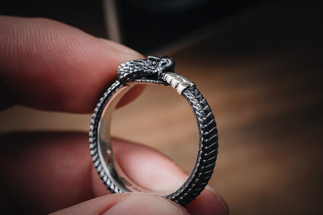 a close up of a person holding a ring