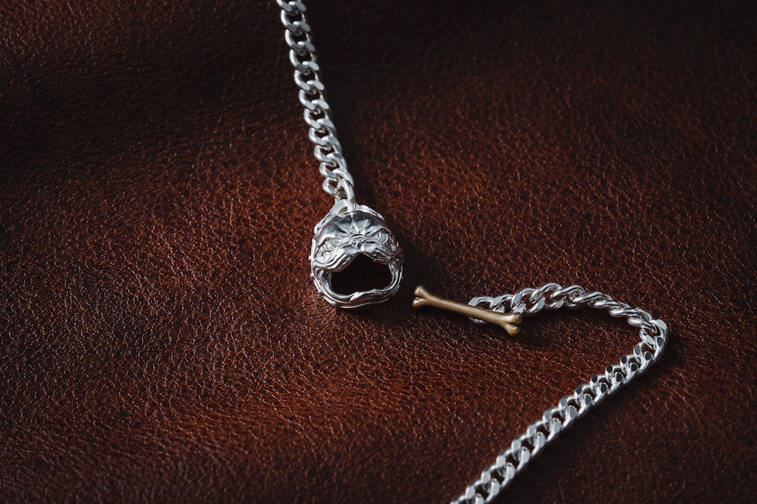 a silver chain with a skull on it