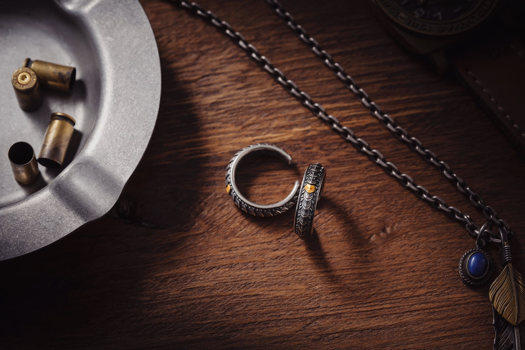a silver ring sitting on top of a wooden table