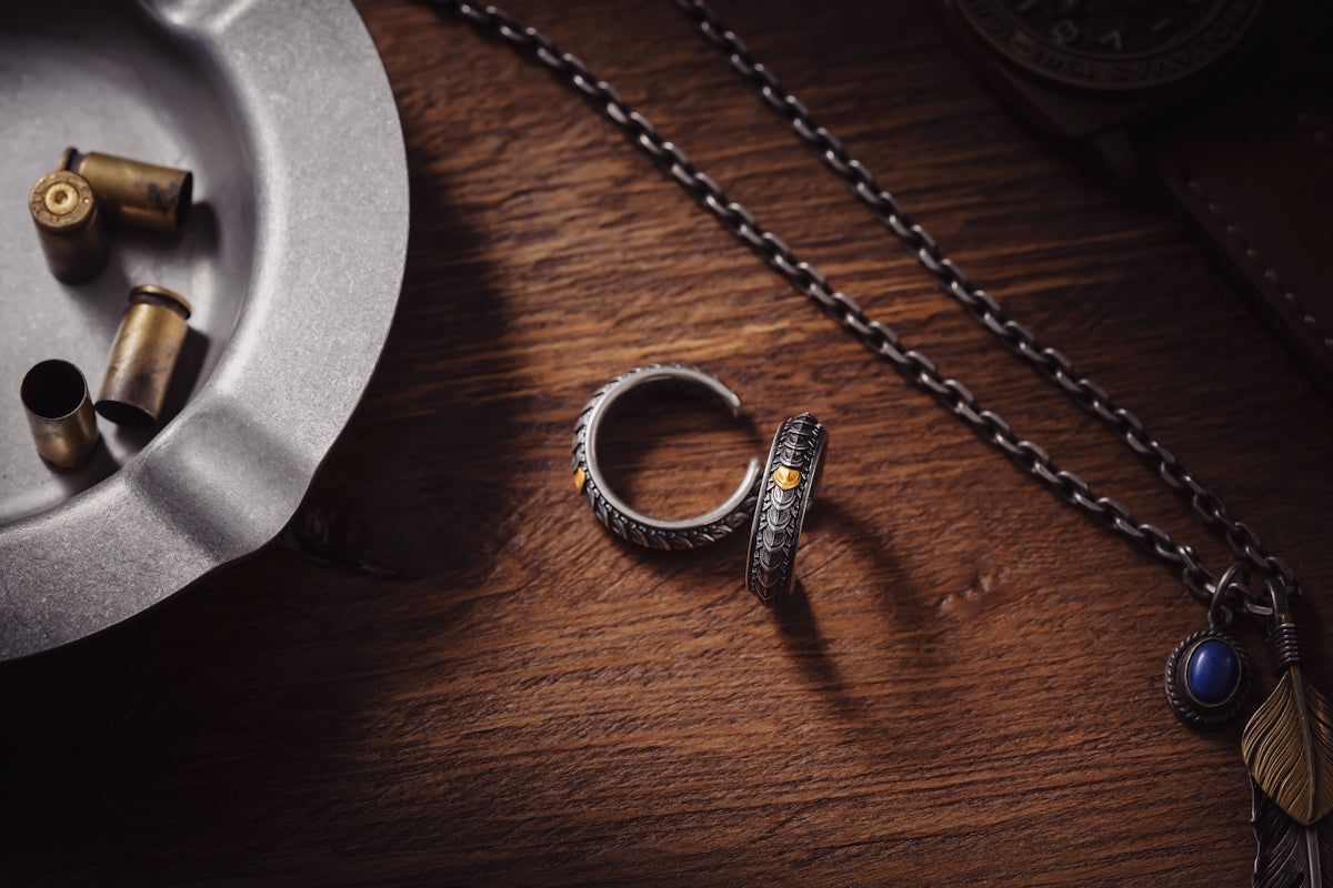 a silver ring sitting on top of a wooden table