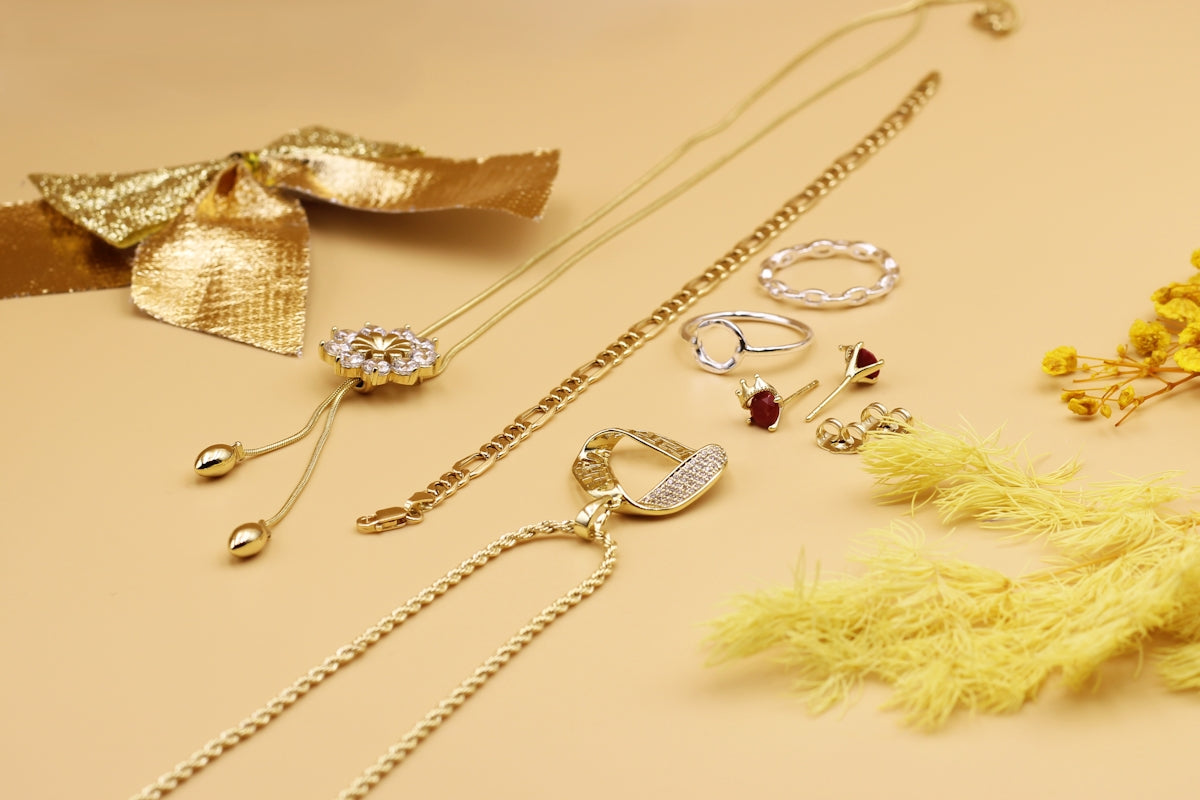 a bunch of jewelry laying on a table