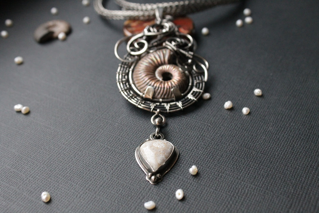 a close up of a necklace on a table