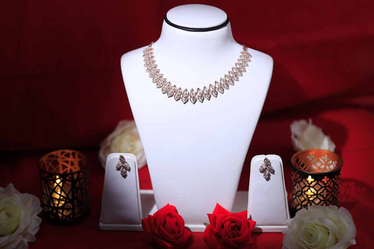 a white mannequin with red roses and a necklace on it