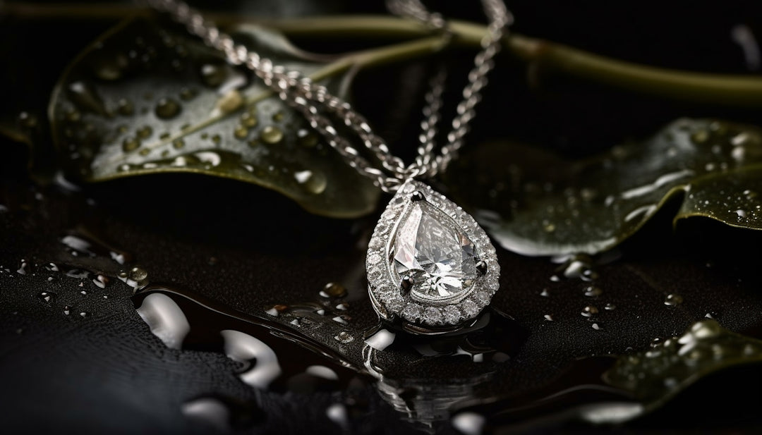 A close up of a necklace on a leaf
