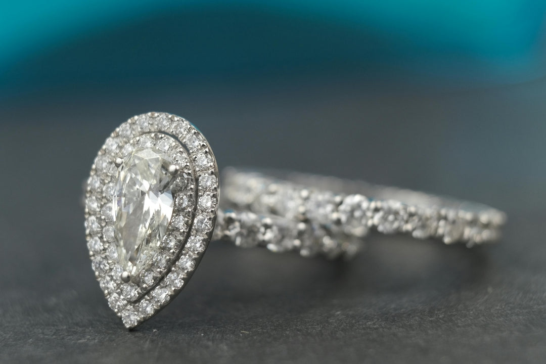 A close up of a diamond ring on a table