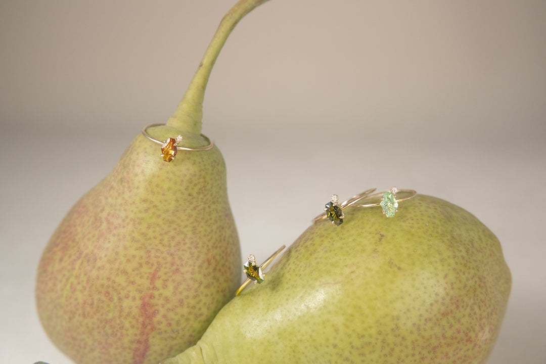 Jewelry adorns pears in this artistic composition.