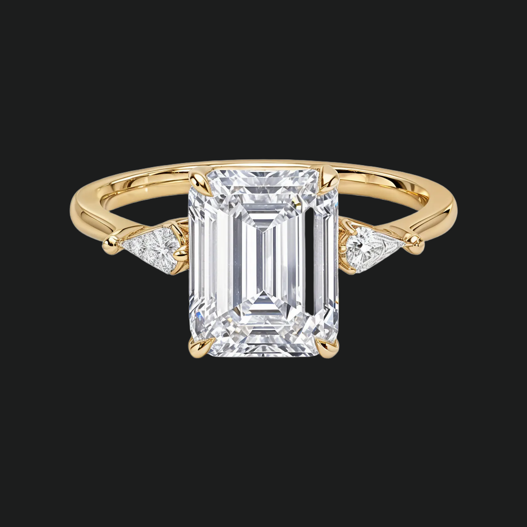 Cometa Emerald Cut Three Stone Diamond Accenten verlovingsring in 9kt witgoud
