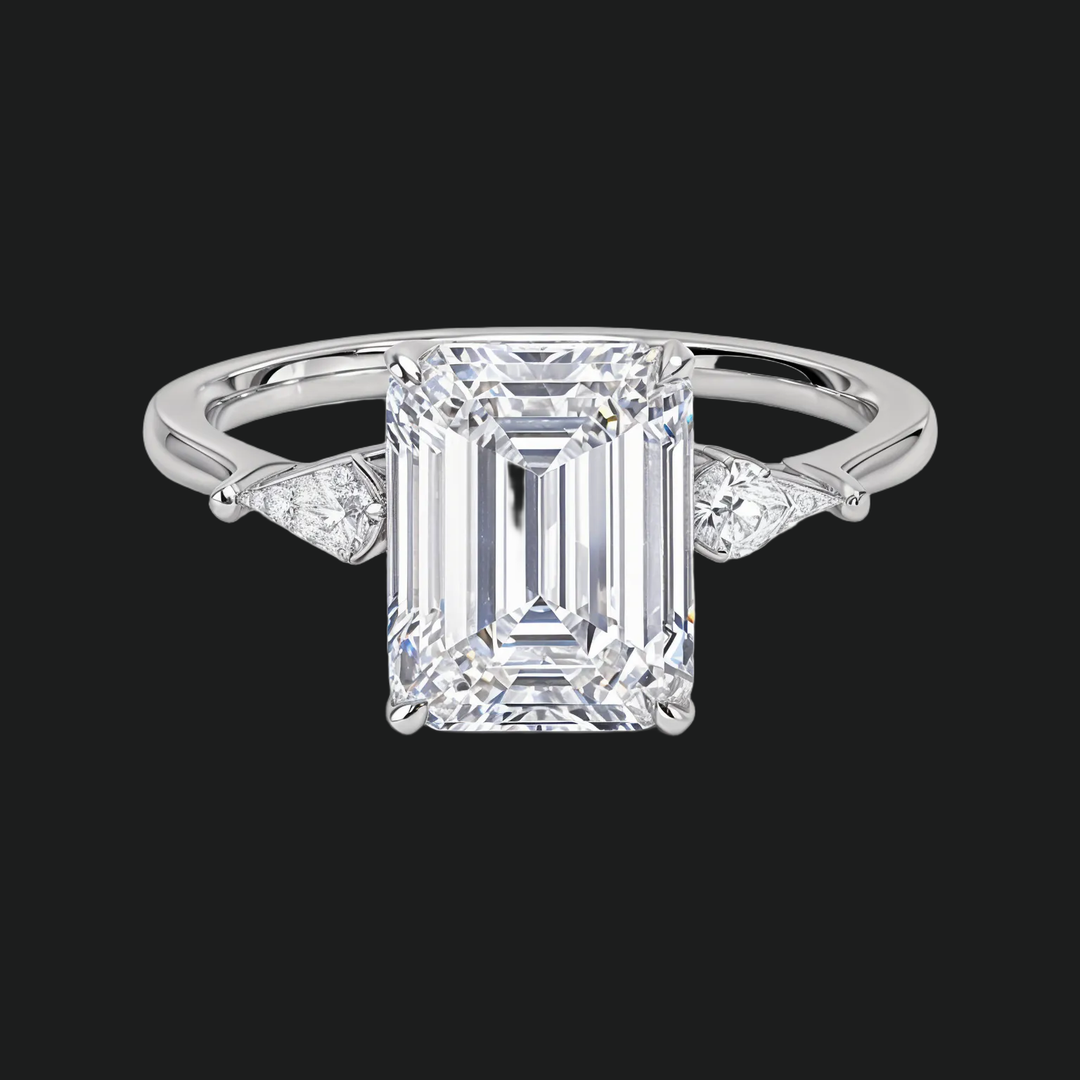 Cometa Emerald Cut Three Stone Diamond Accenten verlovingsring
