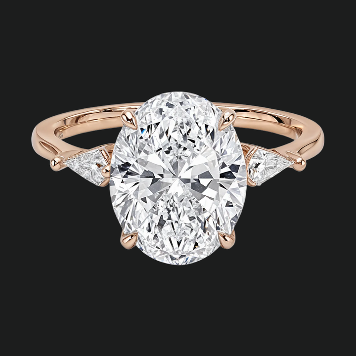 Ovaal gesneden drie stenen diamant accenten verlovingsring