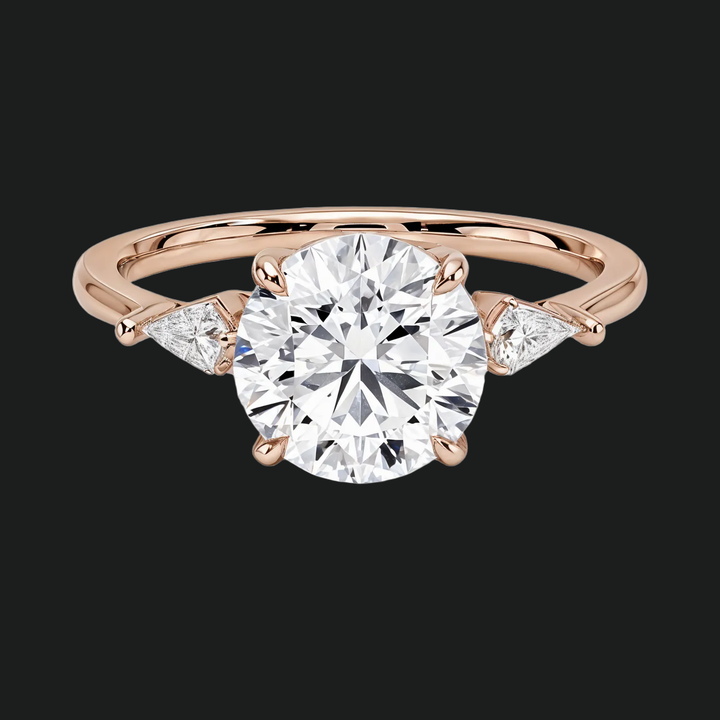 Cometa drie stenen ronde diamant accenten verlovingsring