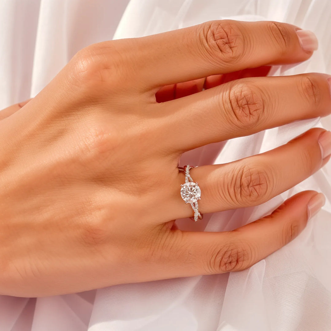 Draai pavé ronde diamant accenten verlovingsring